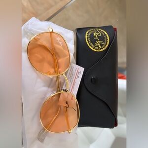 Ray Ban 100% UV protecting color light orange
